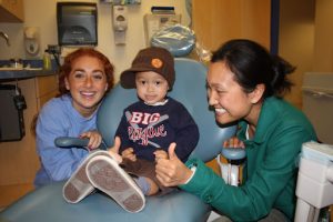 Three smiles in a treatment room
